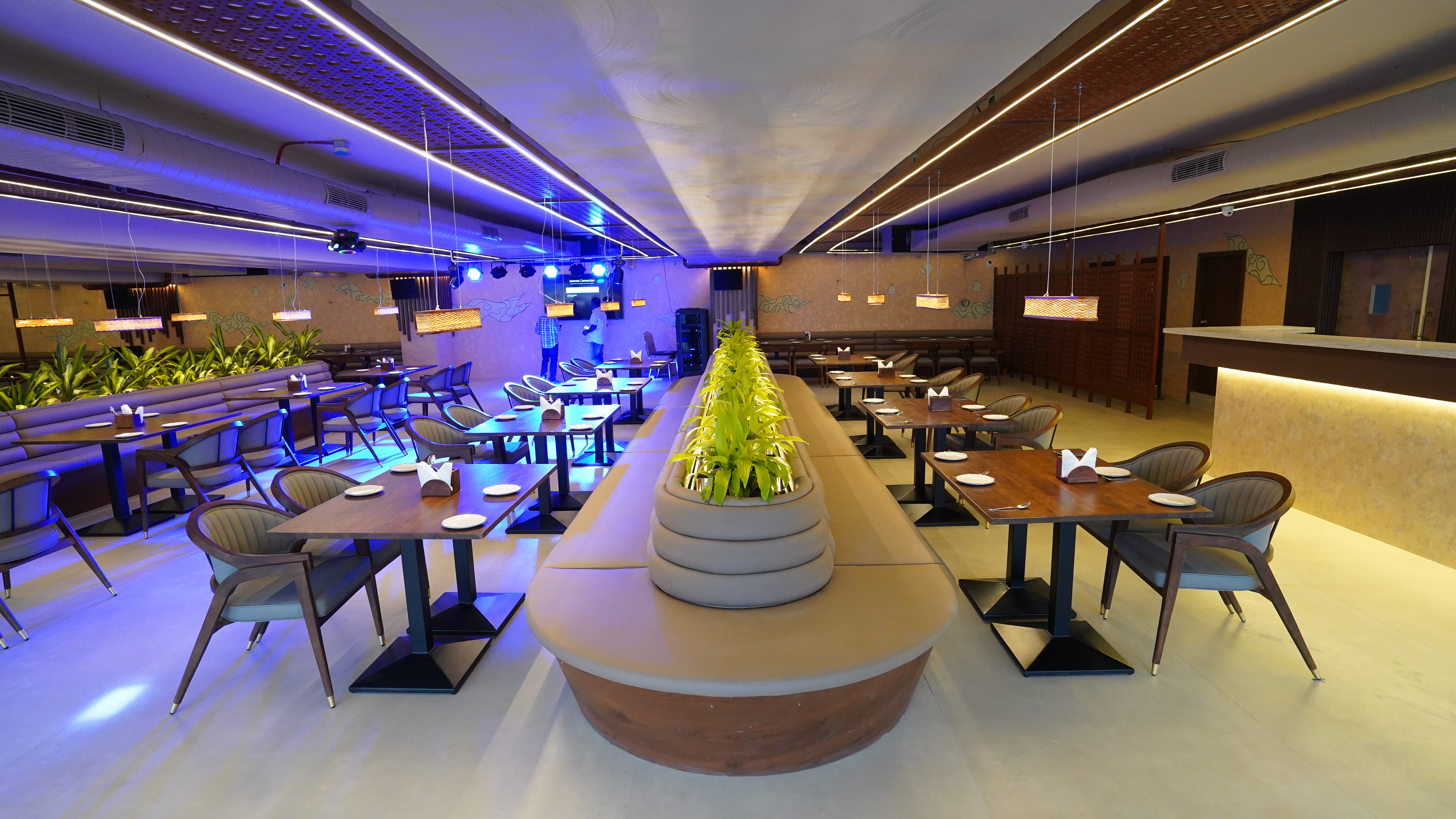 Cozy and elegant restaurant interior with warm lighting, wooden tables, and inviting atmosphere