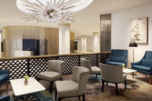Luxurious seating area with plush cushions, elegant tables, and warm ambient lighting perfect for intimate gatherings