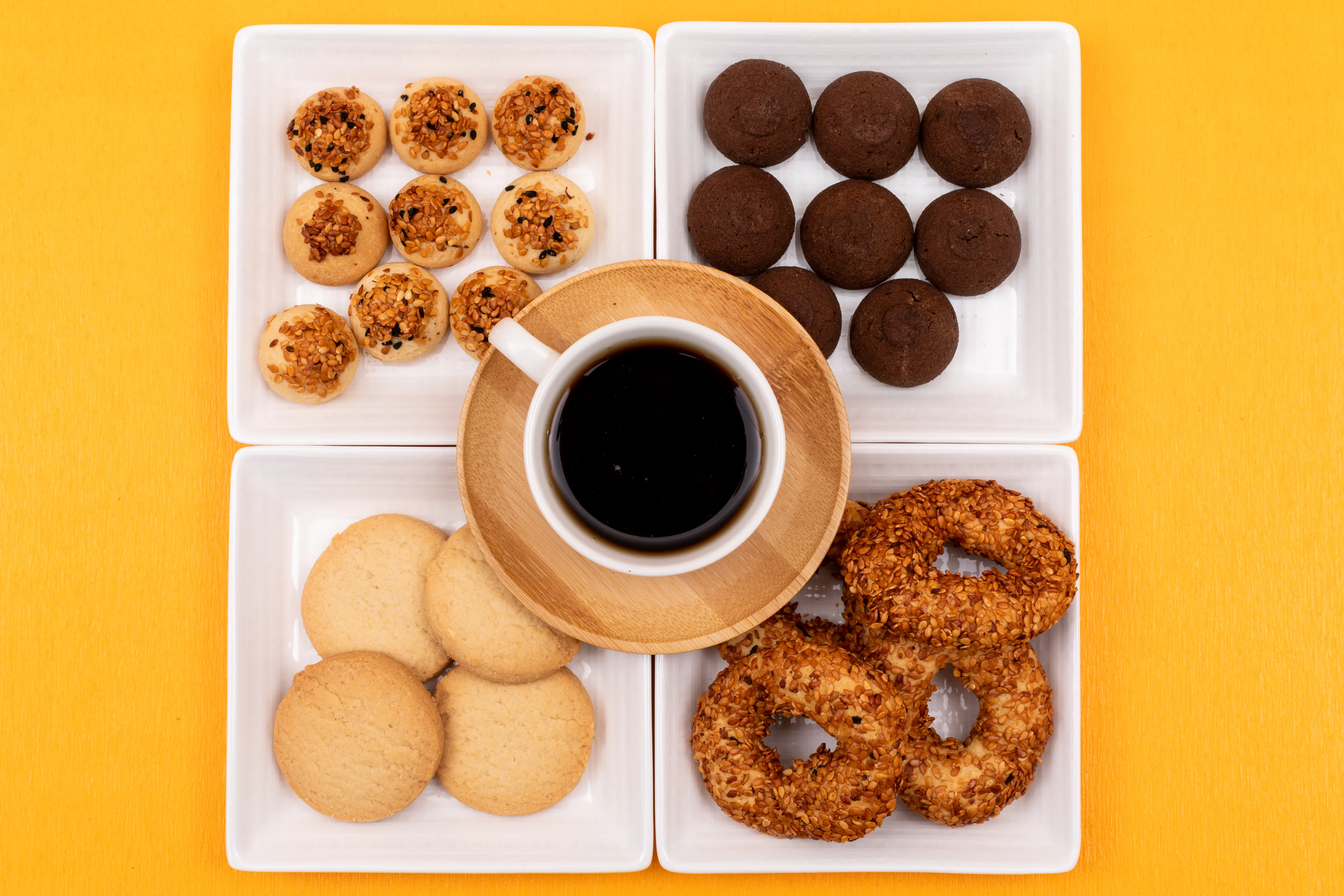 Freshly baked chocolate chip cookies on a wooden board